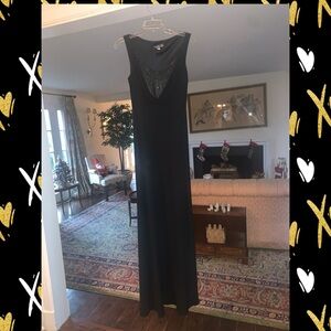 Melinda Eng black crepe gown with black sequin detail at the neck.